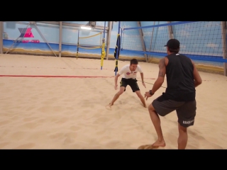 on an elastic band in the sand. beach volleyball training